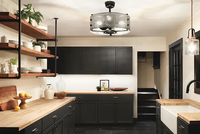 A fitted kitchen with open shelving and butcher block counters, showcasing KCT Kitchens' craftsmanship